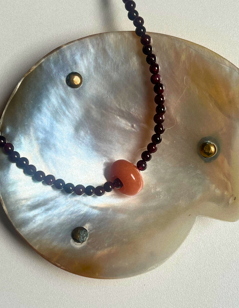Idle Hands 1 - Garnet Movement Necklace