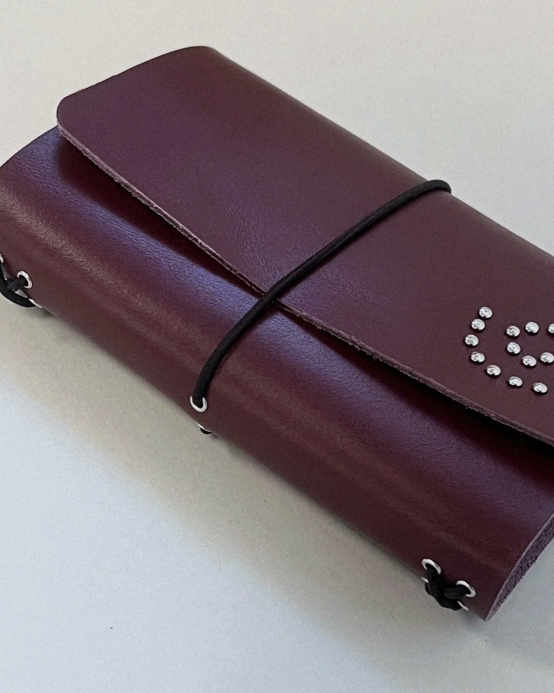 Side view of the oxblood Spiral Field Journal